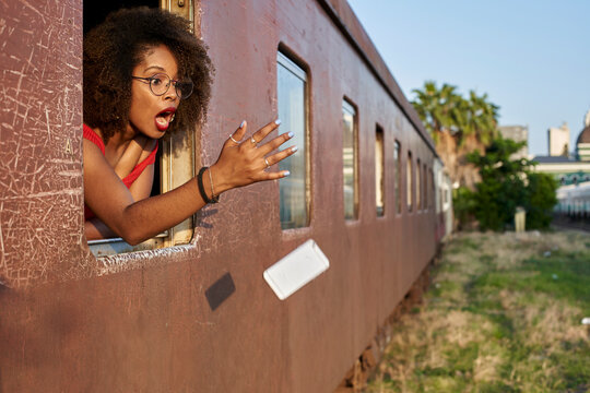 Woman's phone falling out of train window
