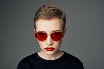 short haired woman with sunglasses fashion isolated background