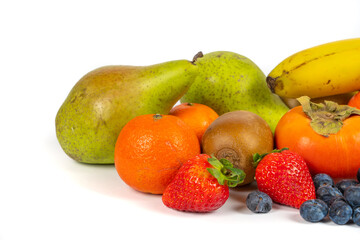 Lots of fresh fruit isolated on a white background, copy space