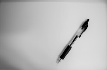 black ballpoint pen on a gray background