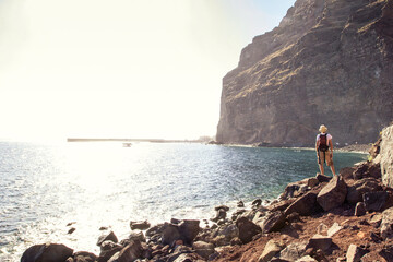 Rear view of hiker at the beach, Valle Gran Grey, La Gomera, Canary Islands, Spain
