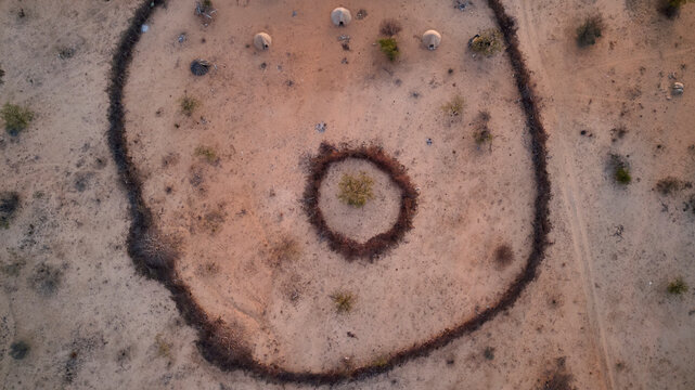 Aerial view of Txitundo Hulo, village Kimbos, surrounded by village fence, in Angola