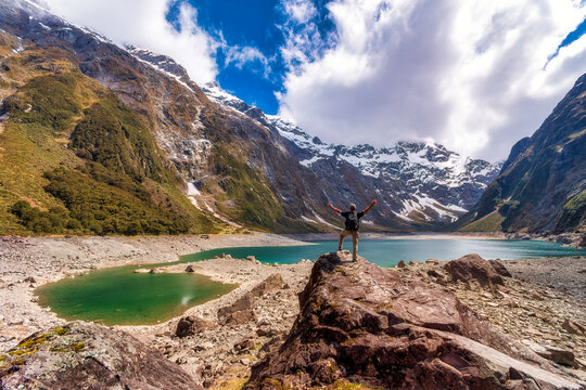 Hiker looking to Lake Marian, Fiordland National Park, South Island, New Zealand
