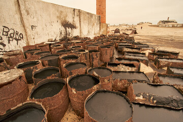 Old oil drums at the abandoned village of Ilha dos Tigres, Angola