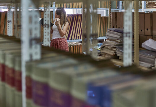 Woman reading book at National library, Maputo, Mocambique