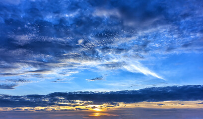 Fototapeta na wymiar Autumn sunset sky with clouds