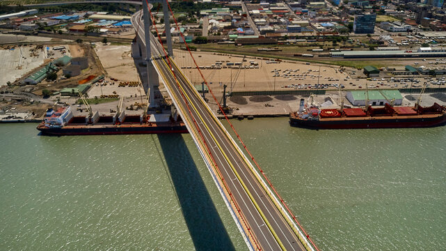 Mozambique, Katembe, Aerial view of two container ships sailing under Maputo-Katembe Bridge