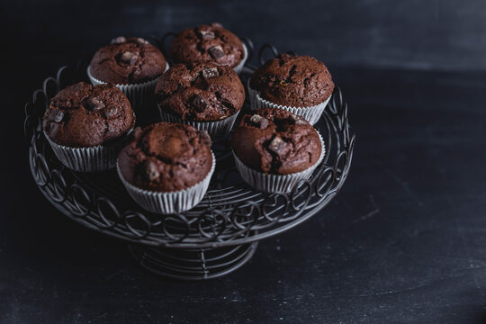 Chocolate muffins on cake stand