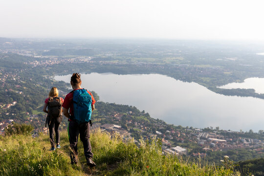 Young couple hiking in mountain meadow
