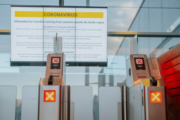 Information sign with safety regulations regarding coronavirus at Oslo airport, Norway