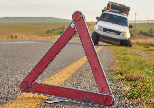 Safety triangle warning of a car accident on the side of the road, South Africa