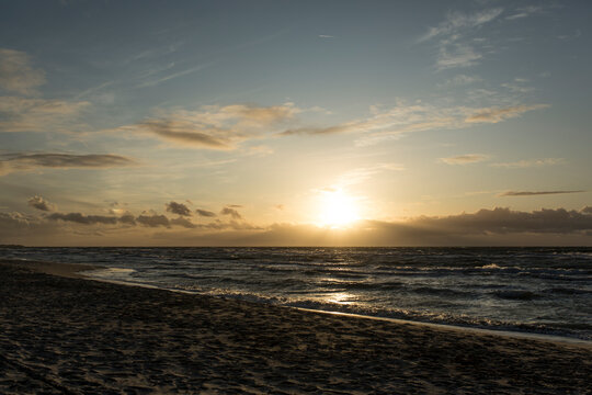 Germany, Mecklenburg-West Pomerania, Prerow, Sandy coastal beach of Baltic Sea at sunset