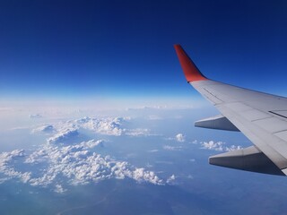 The plane is flying among the clouds