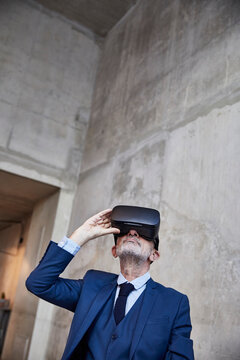 Senior businessman using VR glasses