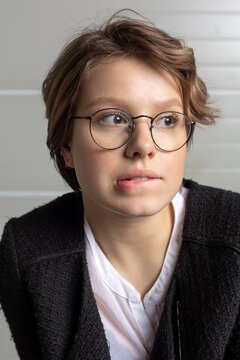 Portrait of young woman biting lip