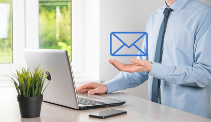 Businessman hand holding e-mail icon, Contact us by newsletter email and protect your personal...