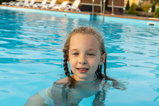 Portrait of a girl swimming in swimming pool