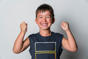 Portrait of strong boy, white background