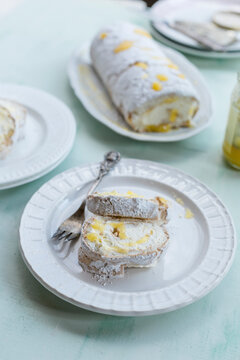 Sliced lemon baiser roll sprinkled with icing sugar