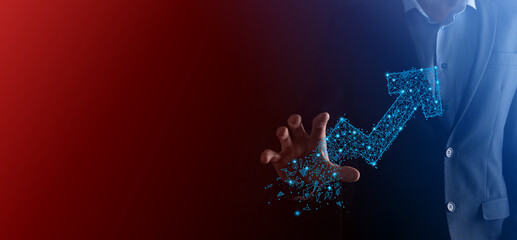 Businessman hold graph, arrow of positive growth icon.pointing at creative business chart with upward arrows.Financial, business growth concept.Low polygonal.increased sales, or increased value