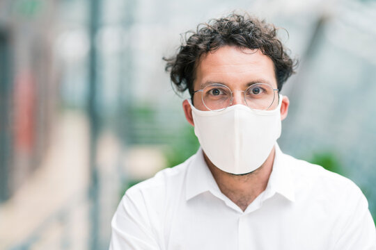Male entrepreneur with protective face mask during COVID-19