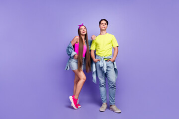 Fototapeta premium Photo of confident friends couple posing together wear denim pin-up outfit isolated violet color background