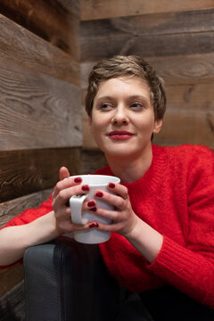 Portrait of content woman with cup of tea