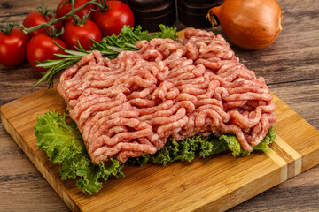 Raw pork minced meat over board