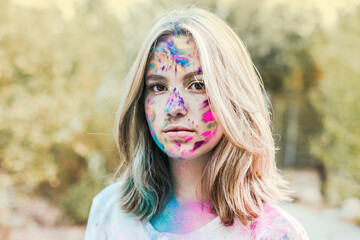 Gir Holi powder colours in her face, Germany