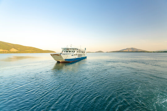 Ship sailing in sea against clear sky at Corfu, Greece