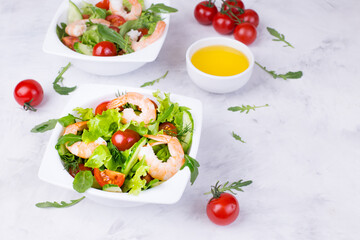 Delicious and healthy shrimp salad with herbs and tomatoes. Dietary nutrition for weight loss. Recipe for cooking fresh seafood. Mediterranean cuisine.