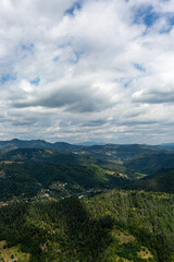 Obraz premium Mountain and forest with dramatic cloudy sky