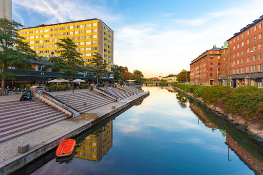 Canal amidst buildings against sky in Malmo, Sweden