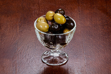 Green and black olives in the bowl