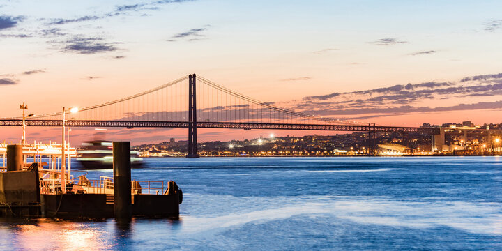 April 25th Bridge over Tagus river seen from Cacilhas at sunset, Lisbon, Portugal