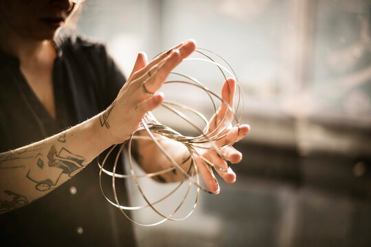 Designer playing with ring forms