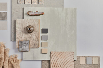 Flat lay of creative architect moodboard composition with samples of building, textile and natural materials and personal accessories. Top view, grey background, template.