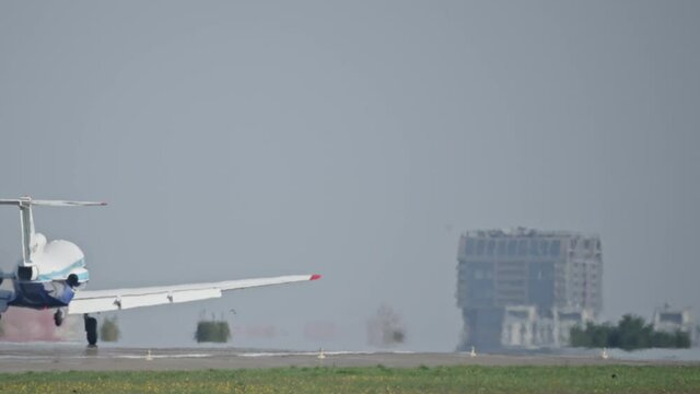 A private plane takes off from the airport runway. Slow motion video of a small plane flying in the sky.