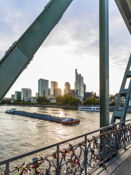 Eiserner Steg over river against sky in Frankfurt, Germany