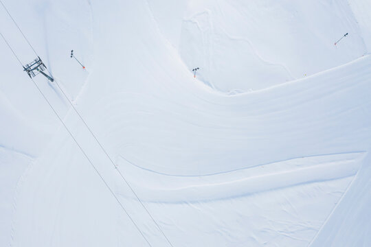 Austria, Tyrol, Galtuer, view to ski slope and chair lift in winter, aerial view