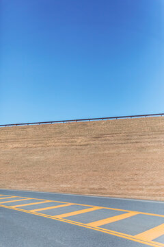 Road marking on empty highway in Ulster County against clear blue sky on sunny day