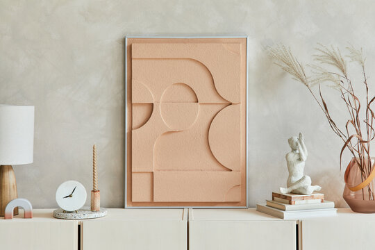 Creative composition of modern beige living room interior design with mock up structure painting, beige wooden sideboard and boho inspired personal accessories. Template.