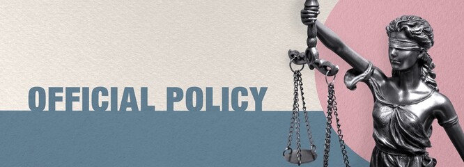 Official Policy. Close-up of a Lady Justice statue. Law and lawyer symbol. Figure stands in front...