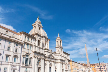 Italy, Rome, Low angle view of Sant Agnese in Agone church with Agonalis obelisk in background
