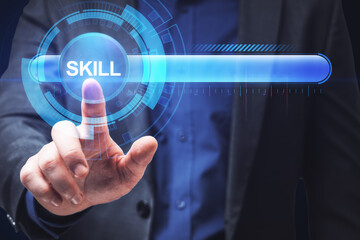 Close up of businessman hand pointing at abstract glowing skill bar. Training, education, technology and improvement concept.