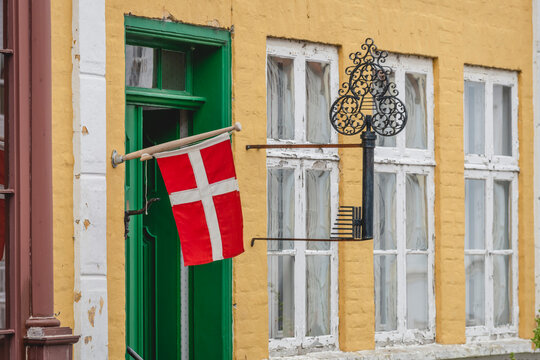 Danish flag hanging outside old building