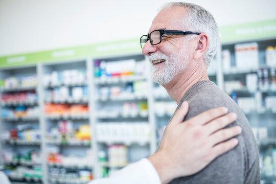 Smiling customer in pharmacy