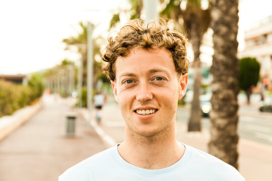 Portrait of smiling young strawberry blonde man