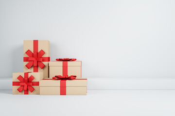 Red present boxes on white backdrop with mock up place. Birthday, wedding, anniversary and christmas celebration. 3D Rendering.
