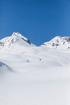 Austria, Tyrol, between Ischgl and Galtuer, Hohe Koepfe, ski tourer climbing up to the summit in winter